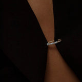 Model wearing 14K gold freshwater pearl bead hoop earring.