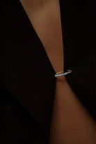 Model wearing 14K gold freshwater pearl bead hoop earring.