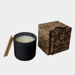Los Poblanos Vela de la Tierra Candle with matte black vessel, bamboo lid, and floral gift box available at YUCCA Denver boutique in Denver, Colorado