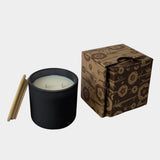 Los Poblanos Vela de la Tierra Candle with matte black vessel, bamboo lid, and floral gift box available at YUCCA Denver boutique in Denver, Colorado
