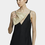 Model holding Maria La Rosa Mini Game Bag in Satin Gold woven ribbon handbag