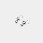 Maslo Jewelry double orb sterling silver drop earrings with polished round beads and sterling silver earwires on light gray background