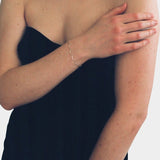 Maslo Jewelry sterling silver scallop bracelet worn on wrist
