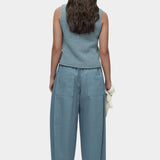 Mijeong Park blue minimal knit tank back view sleeveless cotton linen knit top with relaxed silhouette styled with wide leg trousers