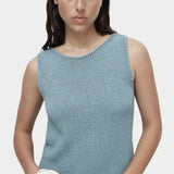 Mijeong Park blue minimal knit tank sleeveless cotton linen knit top styled with wide leg blue trousers minimalist summer outfit