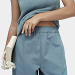 Mijeong Park blue minimal knit tank close up showing cotton linen knit texture and boat neckline sleeveless minimalist knit top