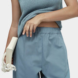 Mijeong Park blue minimal knit tank close up showing cotton linen knit texture and boat neckline sleeveless minimalist knit top