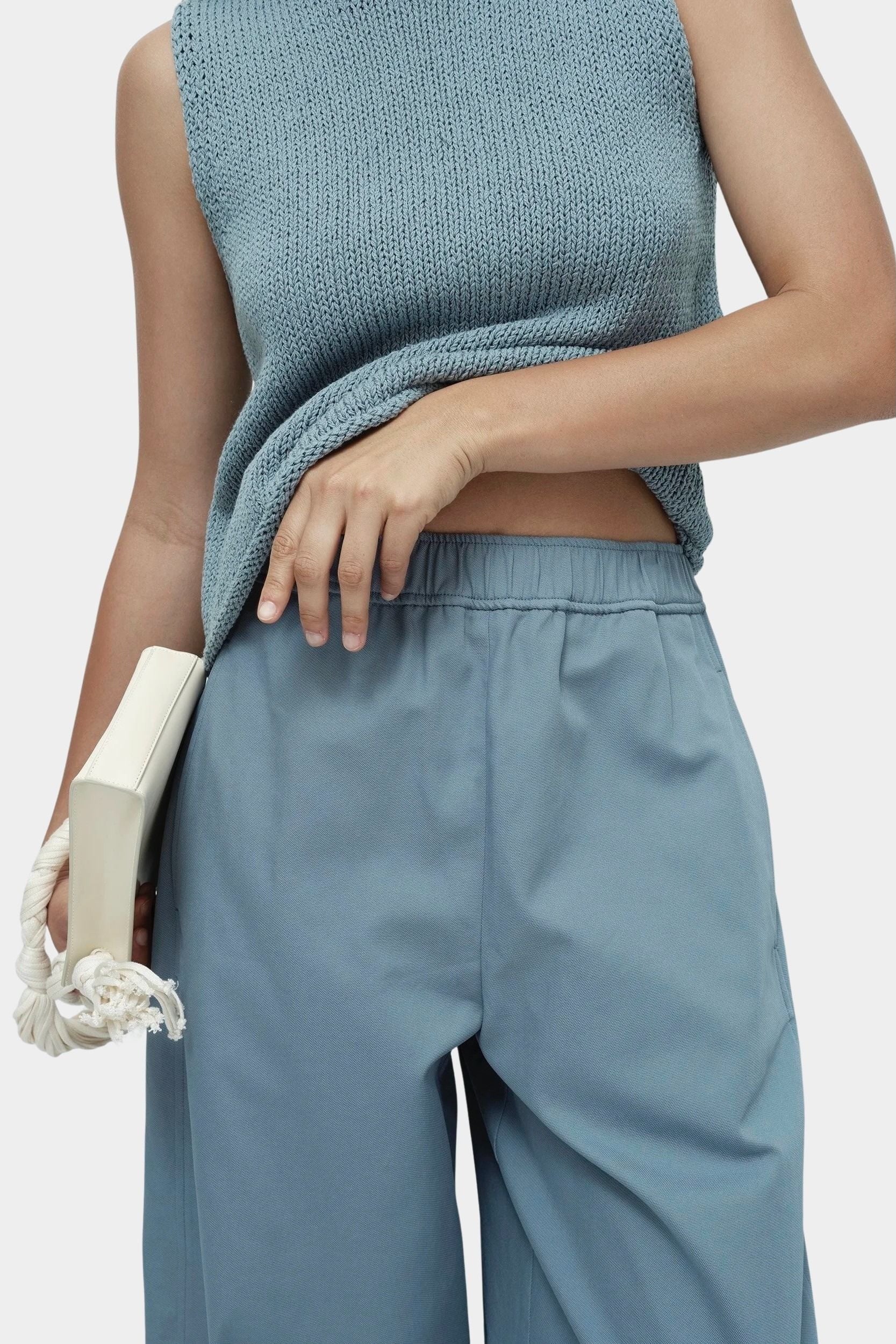 Mijeong Park blue minimal knit tank close up showing cotton linen knit texture and boat neckline sleeveless minimalist knit top