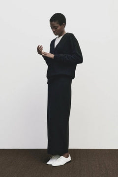 Black cashmere blend knit midi skirt by Mijeong Park