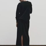 Black cashmere blend knit midi skirt by Mijeong Park