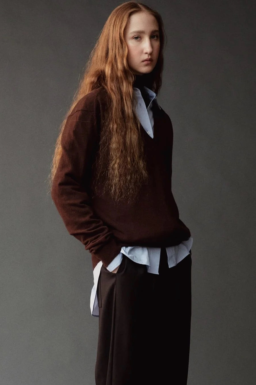 Mijeong Park Cashmere Blend V-Neck Knit Brown side view styled over a blue button-down shirt