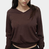 Close-up of brown cotton blend v neck knit top by Mijeong Park showing lightweight knit texture