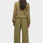 Full look of green cotton blend v neck knit top by Mijeong Park with relaxed silhouette and wide leg knit pants