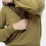 Detail of green cotton blend v neck knit top by Mijeong Park showing sleeve cuff and lightweight knit texture