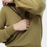 Detail of green cotton blend v neck knit top by Mijeong Park showing sleeve cuff and lightweight knit texture
