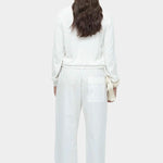 Back view of white cotton blend v neck knit top by Mijeong Park with relaxed fit
