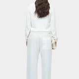 Back view of white cotton blend v neck knit top by Mijeong Park with relaxed fit