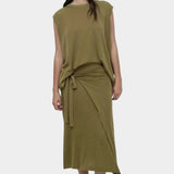 Full outfit green drape back knit top by Mijeong Park styled with matching wrap knit skirt