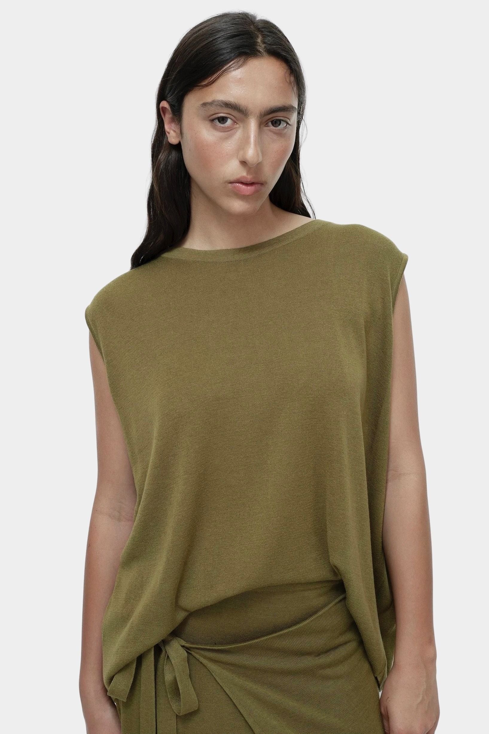 Front portrait green drape back knit top by Mijeong Park with relaxed sleeveless knit silhouette