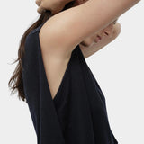 Side detail navy drape back knit top by Mijeong Park showing deep arm opening and fluid knit drape