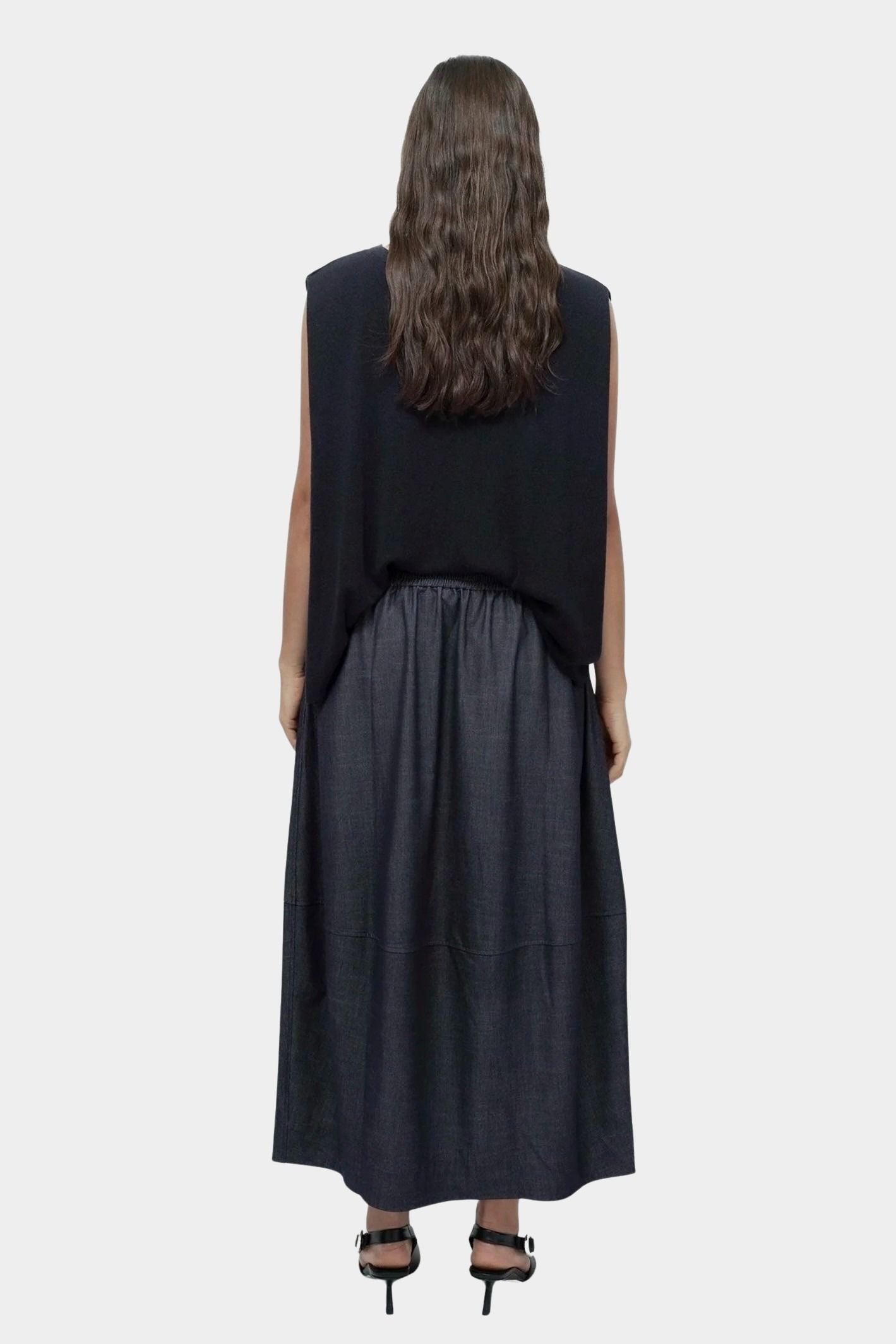 Back view navy drape back knit top by Mijeong Park with relaxed sleeveless silhouette