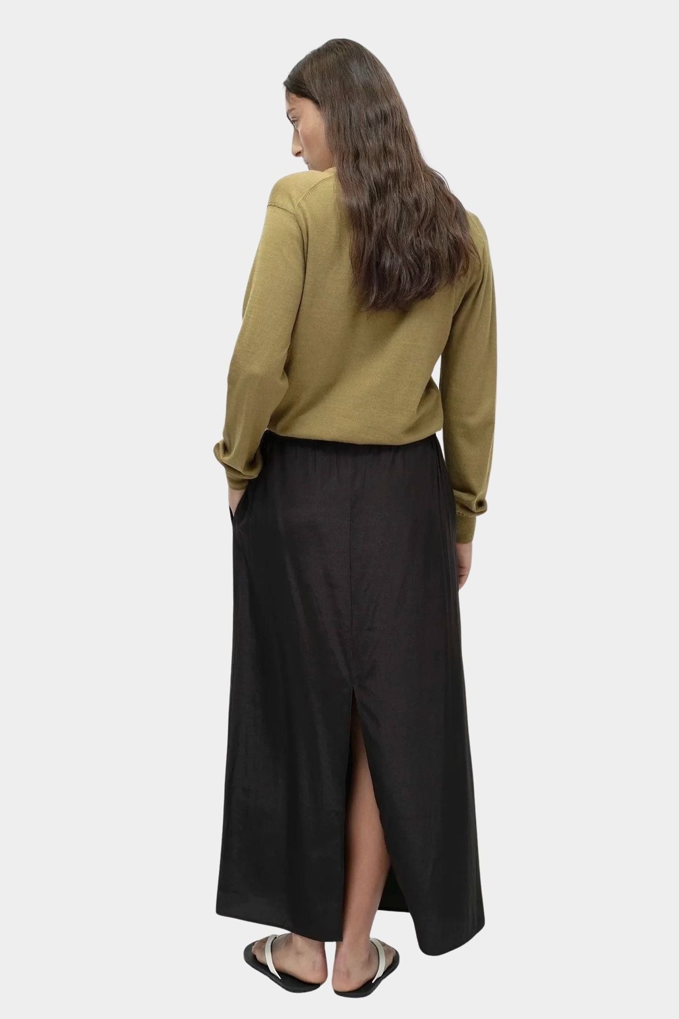Mijeong Park black drawstring midi skirt back view elastic waistband straight silhouette center back slit