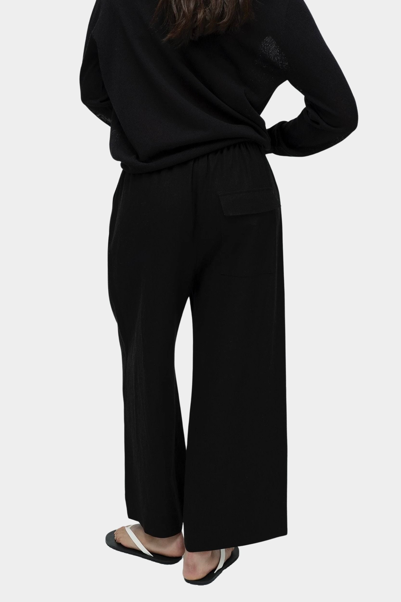 Mijeong Park black linen blend cropped pants wide leg elastic drawstring waist back view womens minimalist designer trousers