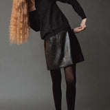 Mijeong Park Mock Neck Cardigan Charcoal styled with black leather skirt at YUCCA Denver