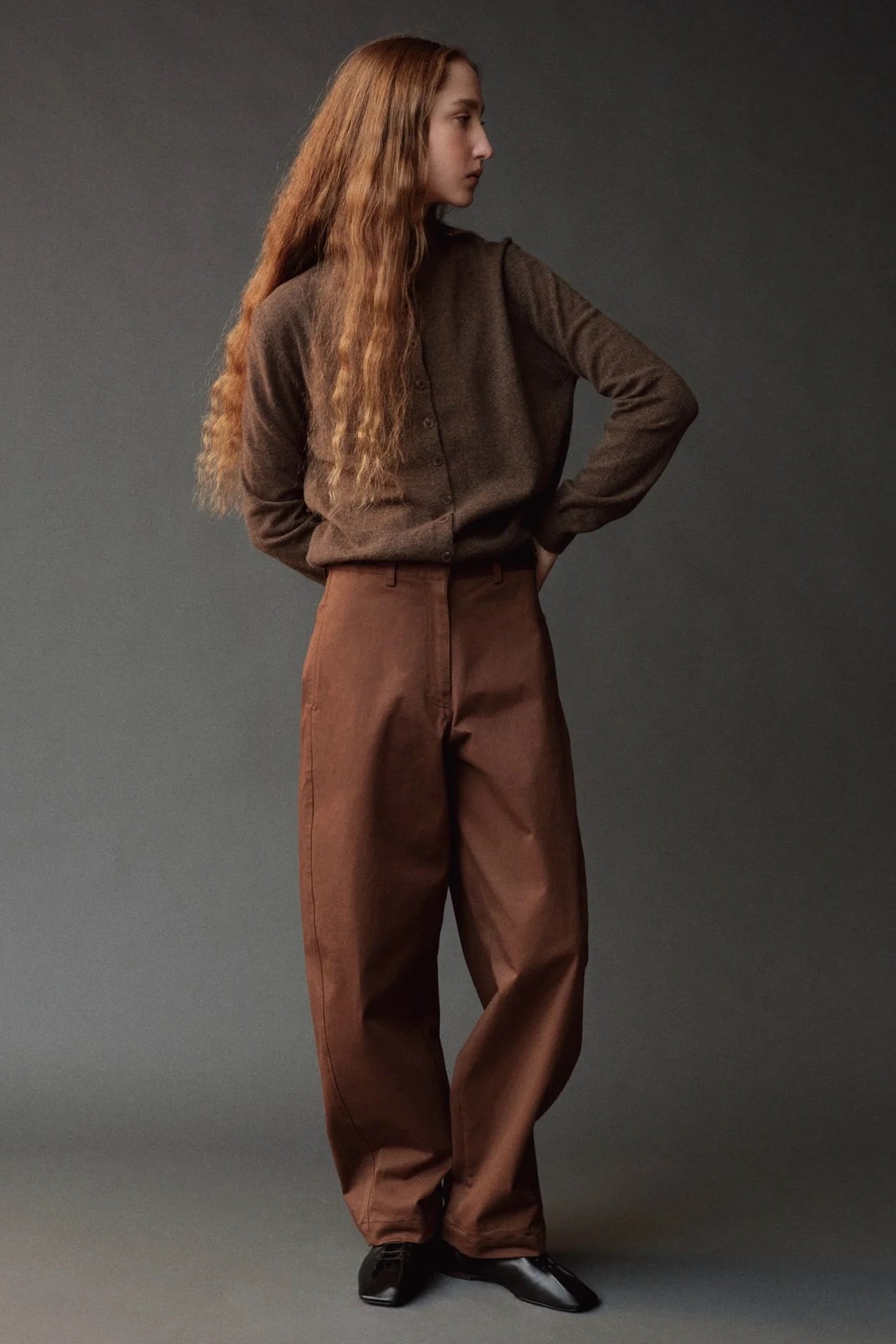 Mijeong Park Mock Neck Cardigan Dark Beige styled with brown trousers at YUCCA Denver