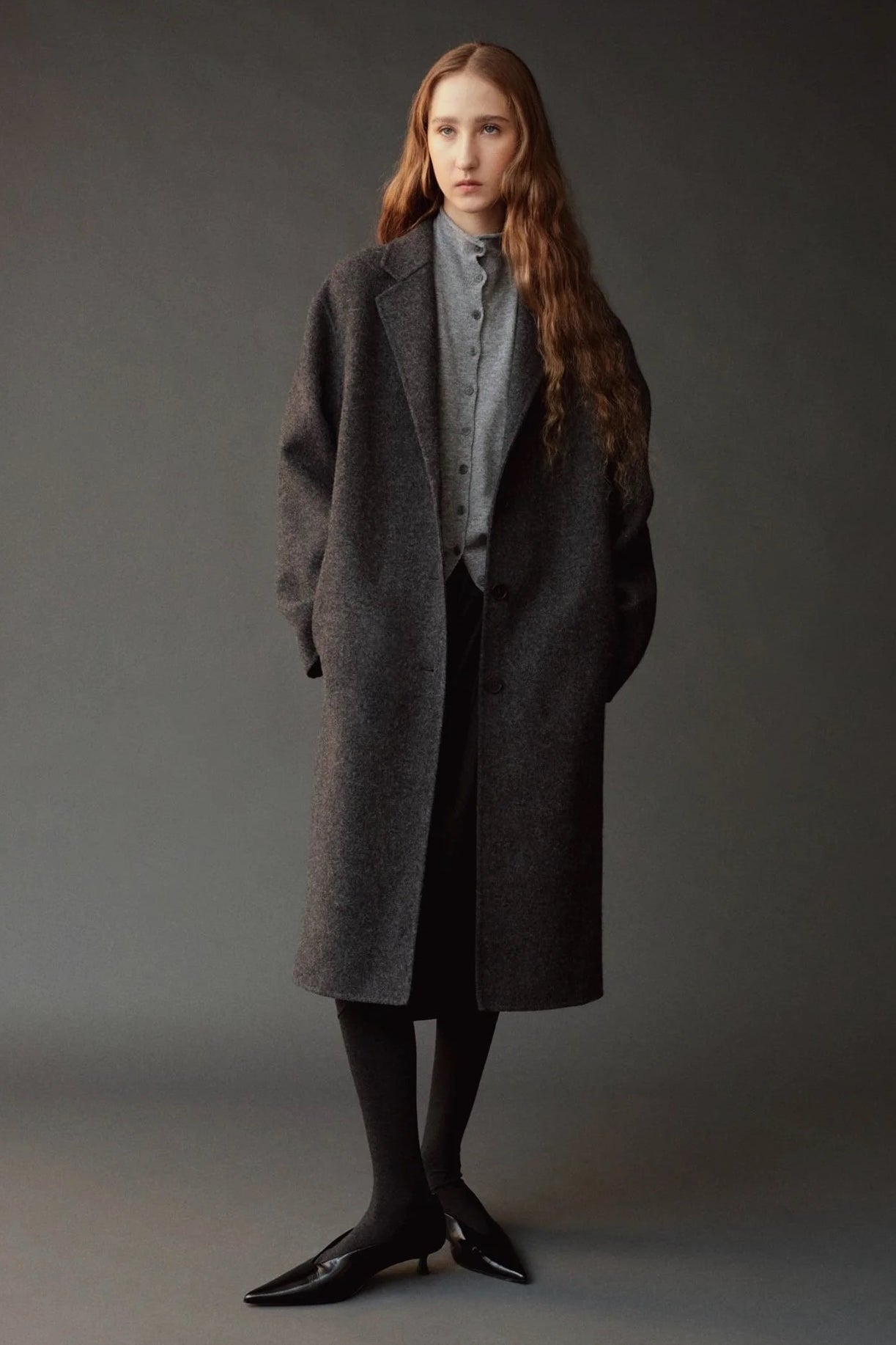 Mijeong Park Mock Neck Cardigan Gray layered under charcoal coat at YUCCA Denver