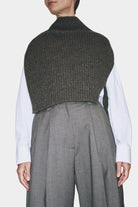 Angled view charcoal ribbed knit cropped neck warmer layered over white shirt