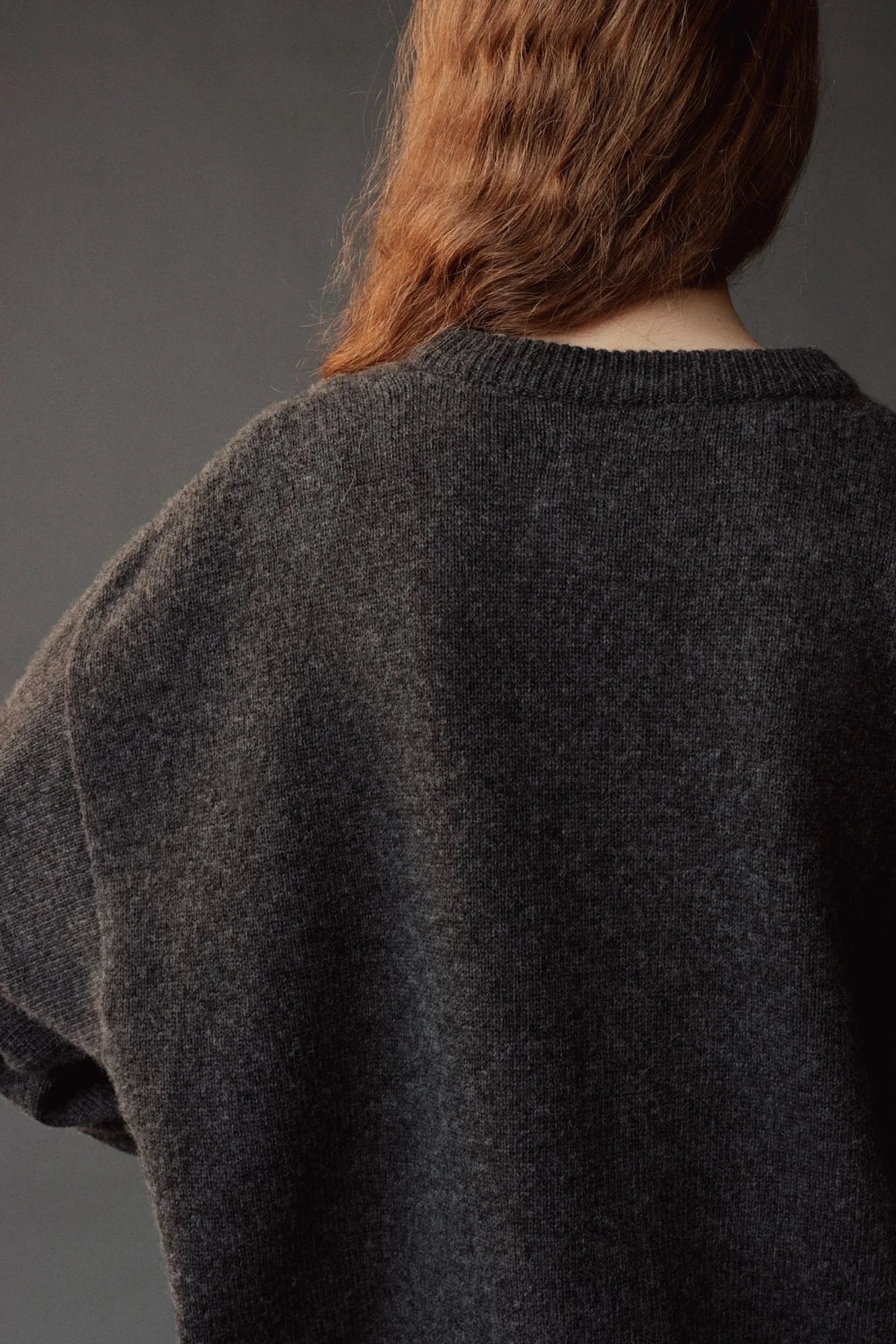 Mijeong Park Oversized Crewneck Sweater Charcoal close up showing soft knit texture and ribbed neckline