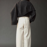 Photo 1
Mijeong Park Oversized Crewneck Sweater Charcoal styled with knit shawl and white wide leg pants, back view