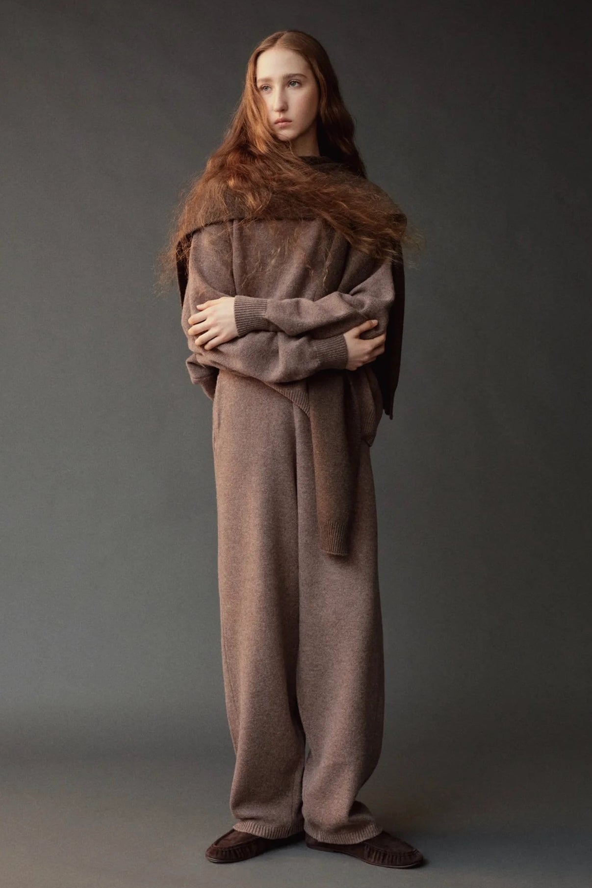 Mijeong Park Oversized Crewneck Sweater Dark Beige layered with matching knit pieces and wide leg pants