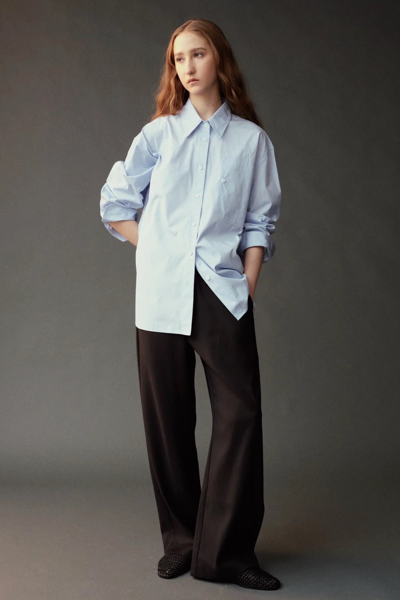 Front view of the Mijeong Park Oversized Shirt in light blue at SHOP YUCCA in Denver