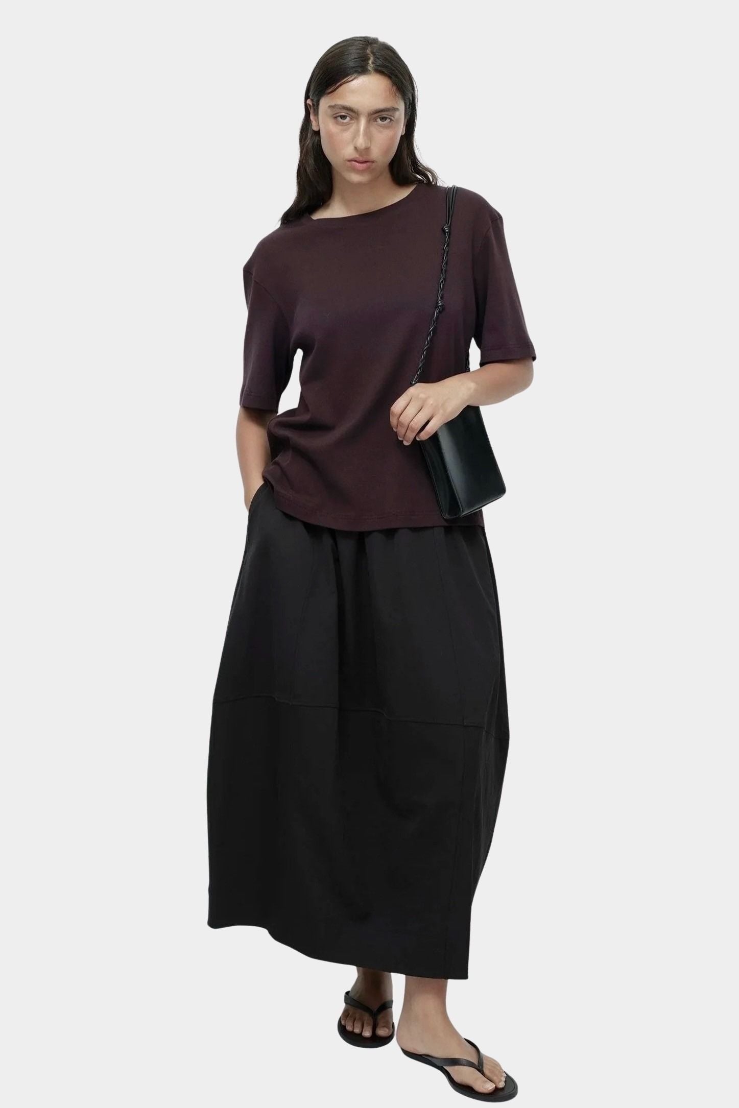 Mijeong Park oversized cotton t-shirt dark brown relaxed crewneck tee full outfit view styled with black skirt