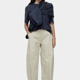 Mijeong Park navy oversized cotton t-shirt styled with beige wide leg trousers minimalist summer outfit