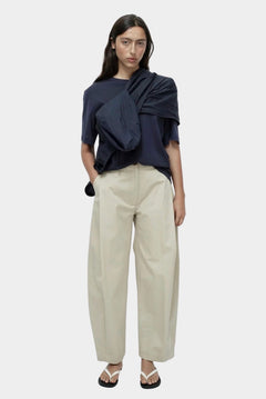 Mijeong Park navy oversized cotton t-shirt styled with beige wide leg trousers minimalist summer outfit