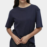 Mijeong Park navy oversized cotton t-shirt relaxed crewneck tee front view styled with dark denim trousers