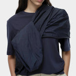 Mijeong Park navy oversized cotton t-shirt close view styled with lightweight navy jacket draped over shoulder