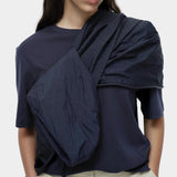 Mijeong Park navy oversized cotton t-shirt close view styled with lightweight navy jacket draped over shoulder
