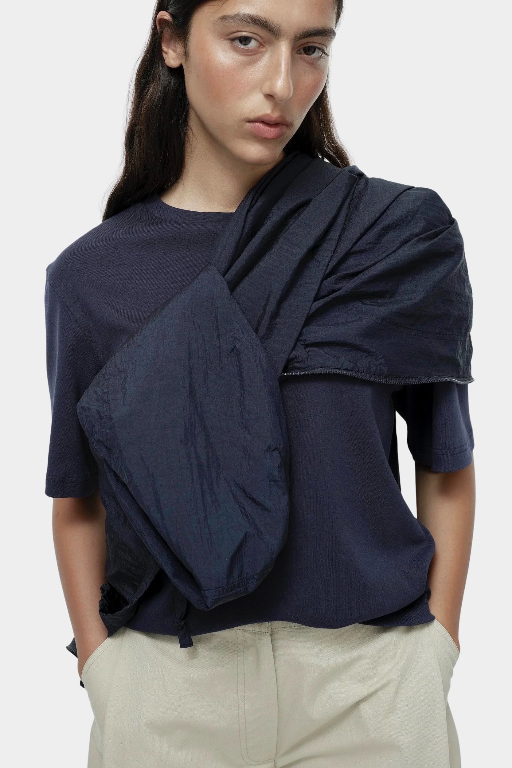 Mijeong Park navy oversized cotton t-shirt close view styled with lightweight navy jacket draped over shoulder