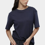 Mijeong Park navy oversized cotton t-shirt relaxed crewneck tee styled with dark denim drawstring trousers