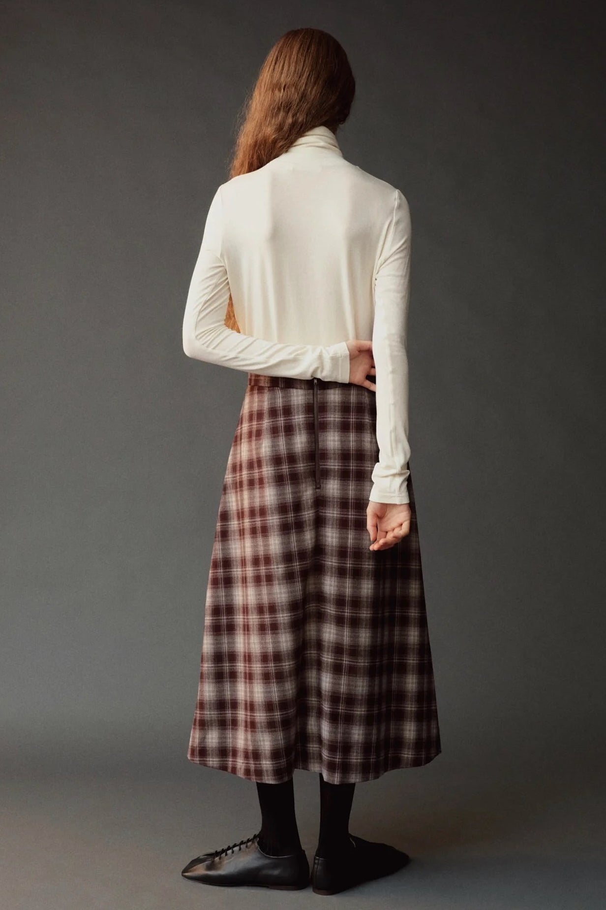 Back view of the Mijeong Park Plaid Midi Skirt showing the center back zipper and A line shape