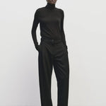 Black slim fit Tencel cotton roll neck top by Mijeong Park