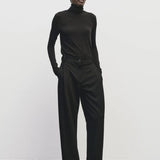 Black slim fit Tencel cotton roll neck top by Mijeong Park