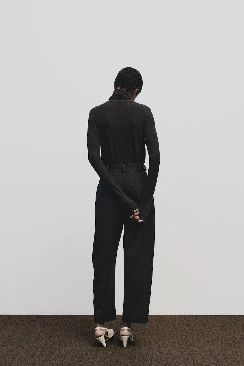 Black slim fit Tencel cotton roll neck top by Mijeong Park
