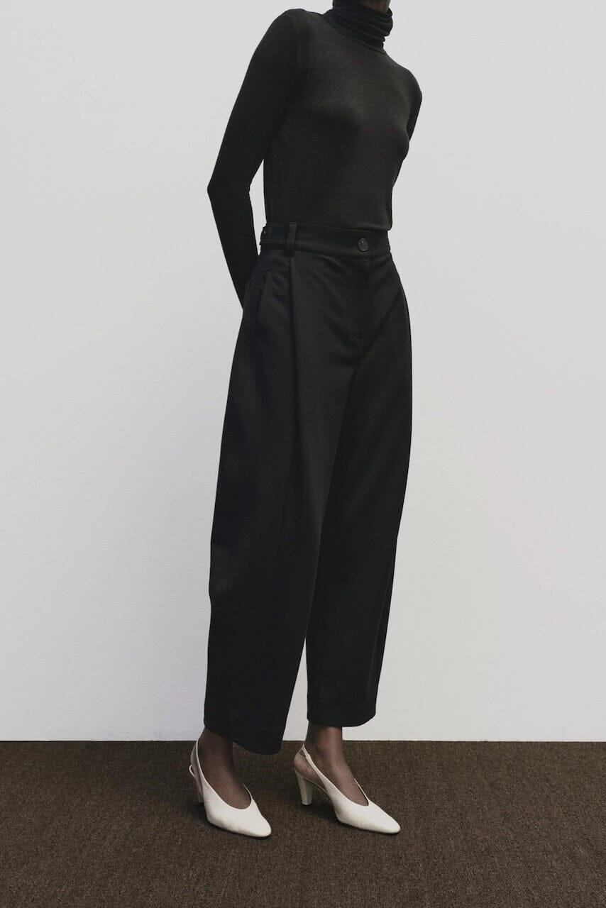 Black slim fit Tencel cotton roll neck top by Mijeong Park