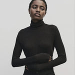 Black slim fit Tencel cotton roll neck top by Mijeong Park