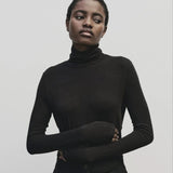 Black slim fit Tencel cotton roll neck top by Mijeong Park